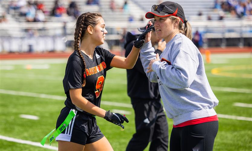 Girls play flag football